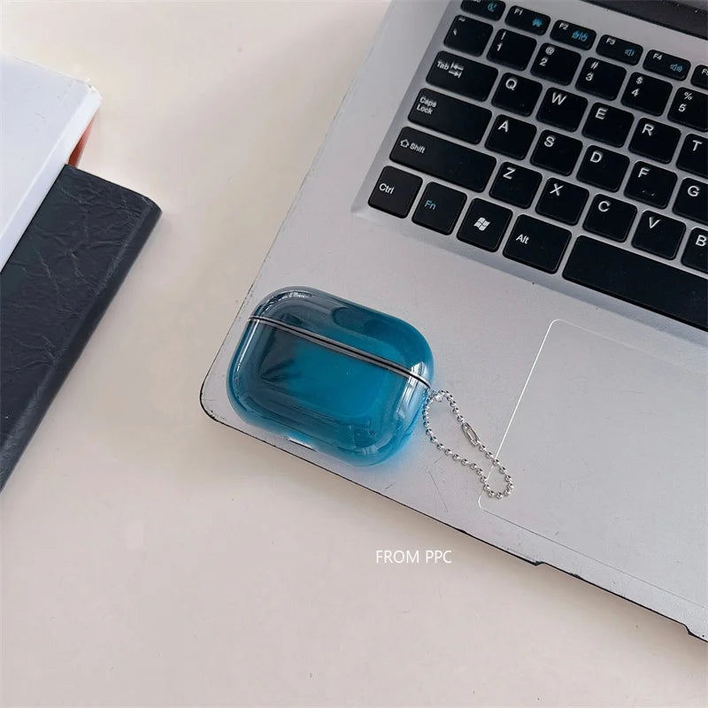 Blue USB drive in a clear case on a laptop keyboard